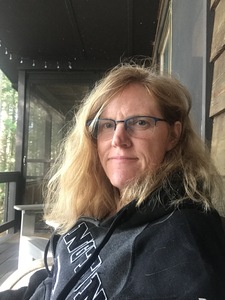 Picture of author sitting outsite