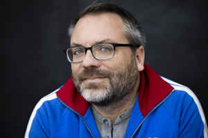 Close up of me wearing a blue coat with red collar