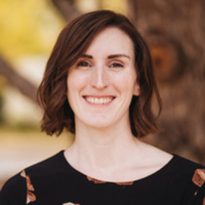 Author Melissa Baron in front of a fall background