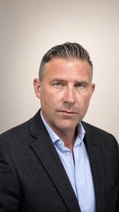 Kyle J Holland, author of Unknown Sky, professional headshot.
