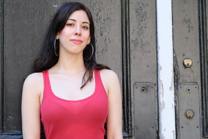 A photo of Christine Stoddard with straight hair, wearing a red tank top.