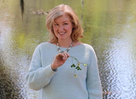 woman standing in front of lake
