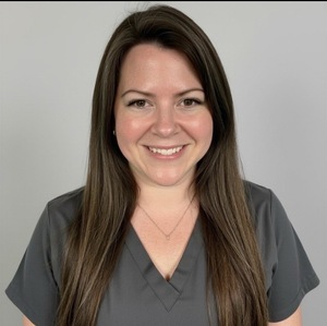Professional headshot of oncology nurse and author Courtney A. Desy