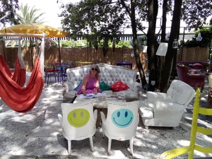 Kathy writing in the Lemon Bar at Marina di Pietrasanta