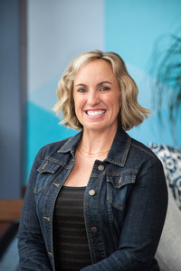 Author headshot with blue background