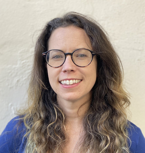 Vanessa Armstrong headshot with pandemic hair. Taken circa 2020 in the parking lot behind my apartment.