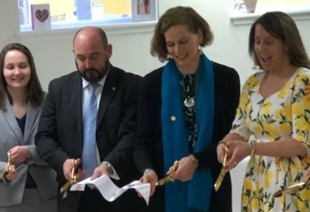 Maria-Gallo-wearing-her-lemon-dress-at-the-ribbon-cutting-horizontal.jpg