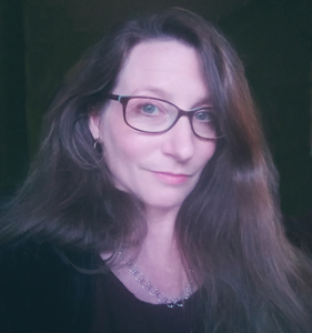 Woman wearing glasses and smiling