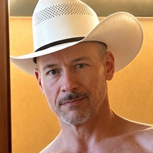 alt="Frank Anthony Polito, Lambda Literary Award-winning author, wearing a cowboy hat."
