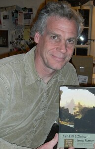 portrait shot holding my newly published book