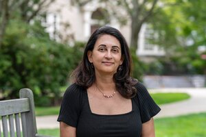 alt="Journalist and Author Lini Kadaba sitting on a bench"