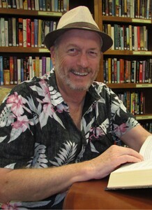 Uncle Earl reading in library