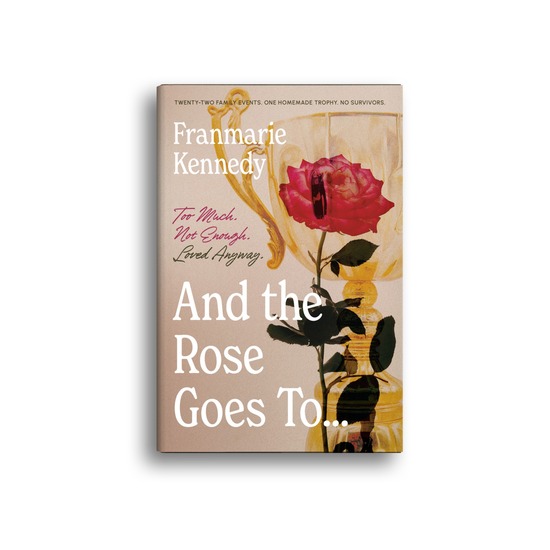 Book cover of And the Rose Goes To… by Franmarie Kennedy, showing a red rose in a gold trophy cup.