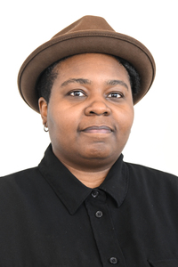 Rasheena Fountain in brown fedora and black shirt. 