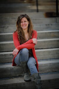 Image of Suzanne Junered sitting on concrete steps