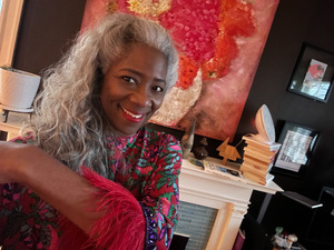 Aurrice Duke smiling in a floral blouse in her office.