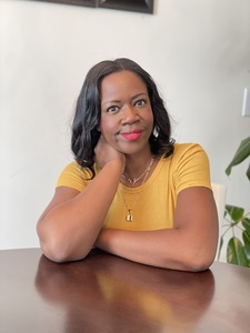 Yasmin sitting at a table