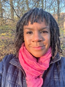 Photo of Kimberly Ruffin in a blue coat in a park
