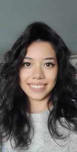 Approachable professional female translator with a warm smile.