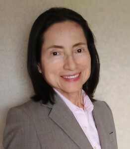 Writer and publisher Sandra Haydée Giroux smiling in outdoor portrait