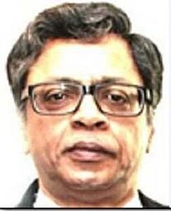 Close-up portrait of a middle-aged man wearing rectangular eyeglasses