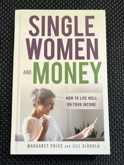 A young woman cheers as she realizes that she understands the financial report she’s received.