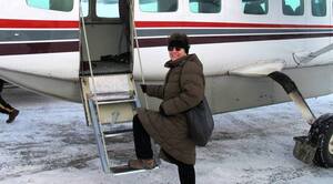 Stephanie Woodard boarding small plane in Alaska