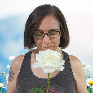 Elsie Gilmore smelling rose