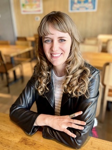 Laura Hawbaker smiling, wearing a black jacket.