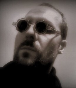 Image of author wearing glasses - black and white finish