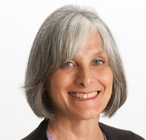 Older woman with medium-length gray hair, smiling