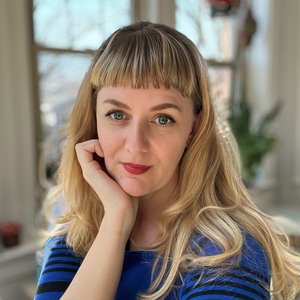 Laura Hawbaker smiling, wearing a black jacket.