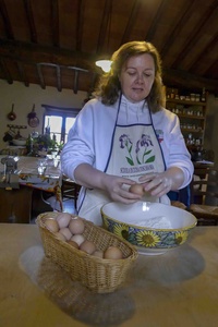 Janelle making pasta in Italy, confidently pretending she knows what she’s doing