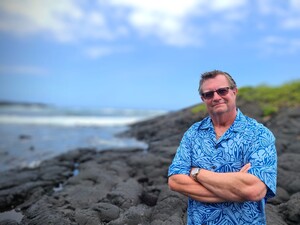A photo of author Tom Bradley Jr., taken at Punalu'u Beach on the Big Island of Hawai'i.