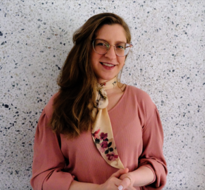 Smiling woman in pink shirt