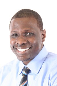 Willie E. Brake, Detroit technology journalist and founder of Web Media Syndicate, professional headshot in a light blue dress shirt and striped tie
