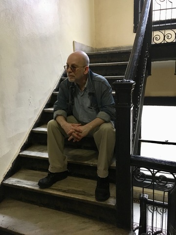 The author, sitting outside his old apartment on East 17th Street, in Flatbush.